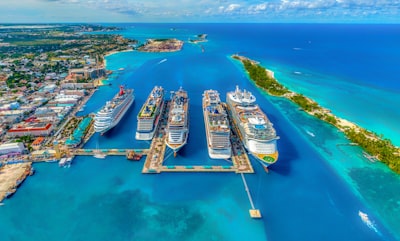 Royal Caribbean cruise ship docked at Nassau Bahamas with passengers walking on the pier